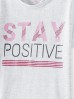 Beżowy t-shirt dziewczęcy z napisem Stay Positive