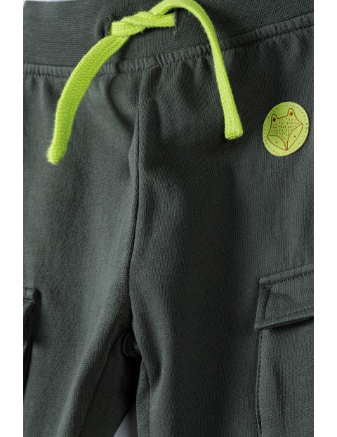Spodnie niemowlęce z kieszeniami - ciemnozielone